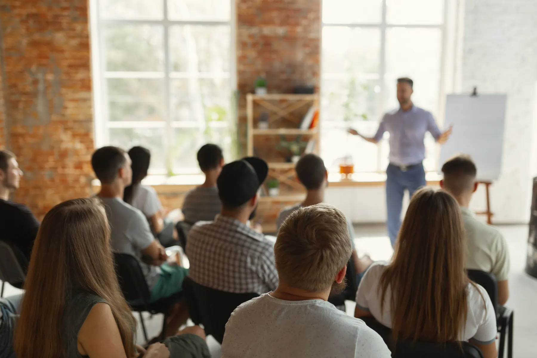 A trainer teaching a room of delegates